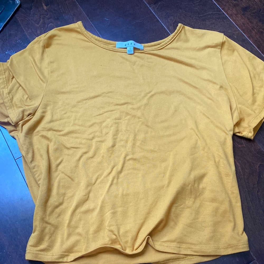 yellow waist length tee shirt